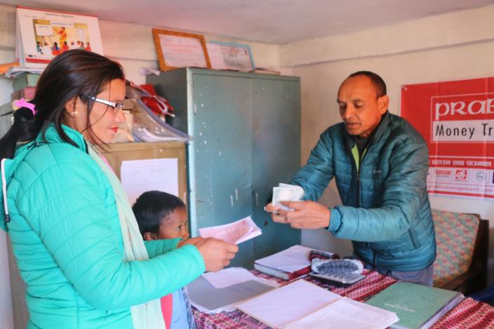 Bhagirathi Bhandari, receiving money sent by husband from Rukum