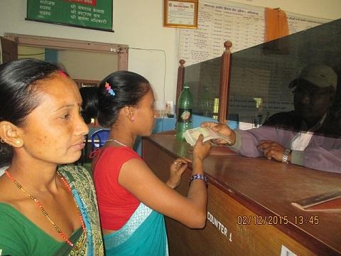 Women farmers take out remittance in a safe manner - Credit: FEJ team/Oxfam