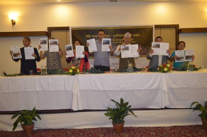 Chief guests show Oxfam's report Building Back Right during a national policy forum to dialogue on the report - Credit: Bed Prasad Dhakal/Oxfam