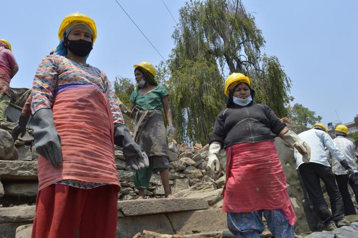 Two of the Cash for Work participants of Dakchinkali ready to shift mud - Credit: Lucia de Vries/Oxfam