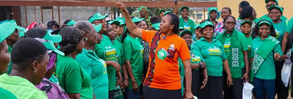 Ogbonge women celebrating, led by Chinasa Asonye (orange T-shirt) Photo: Maxwell Osarenkhoe/Oxfam