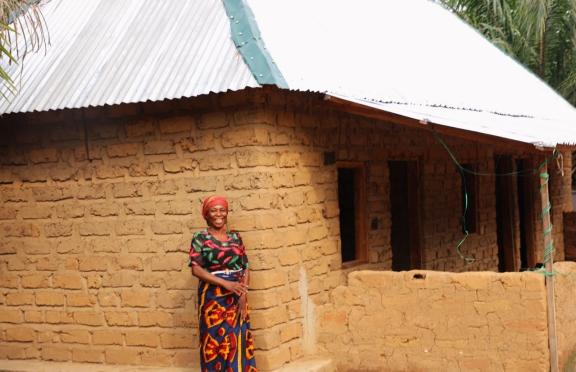 Miracle with one of her newly remodeled houses Miracle with one of her newly remodeled houses