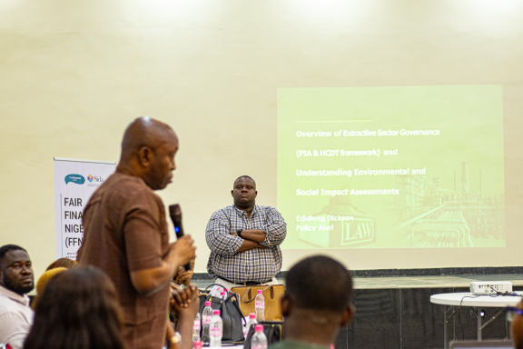 Presenter explaining the Petroleum Industry Act and HCDT framework to host community stakeholders in Akwa Ibom.