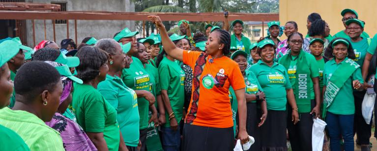Ogbonge women celebrating, led by Chinasa Asonye (orange T-shirt) Photo: Maxwell Osarenkhoe/Oxfam