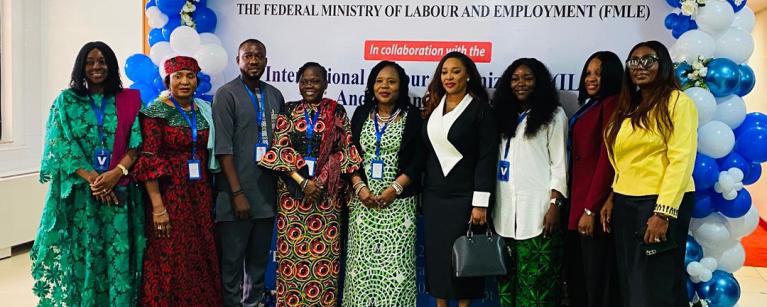 Stakeholders from Oxfam, the Federal Ministry of Labour and Employment (FMLE), and the International Labour Organization (ILO) posing together on stage at the National World of Work Gender Policy re-validation meeting on October 2nd, 2025.
