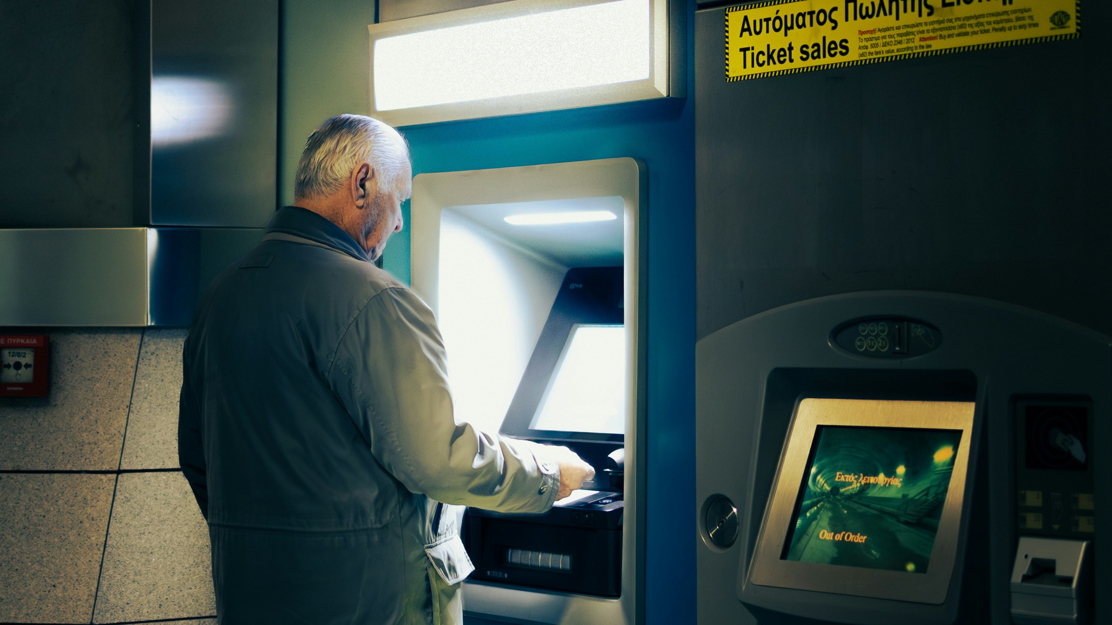 A man using an ATM.