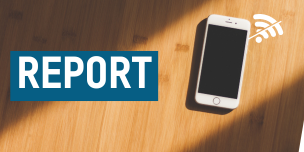 A phone sitting on top of a wooden table, with a graphic depicting no internet signal. Text overlaid reading "report".