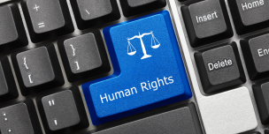 Image of a keyboard, with a key for human rights
