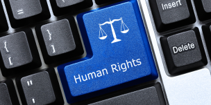 Image of a keyboard, with a key for human rights