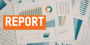A collection of charts and graphs spread across a surface. Text reading "report".