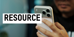 A person holds a smartphone. Text reading "resource".