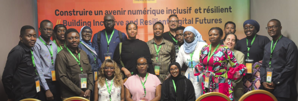 Group photo of attendees and speakers at a DRIF panel, gathered and smiling for the camera.