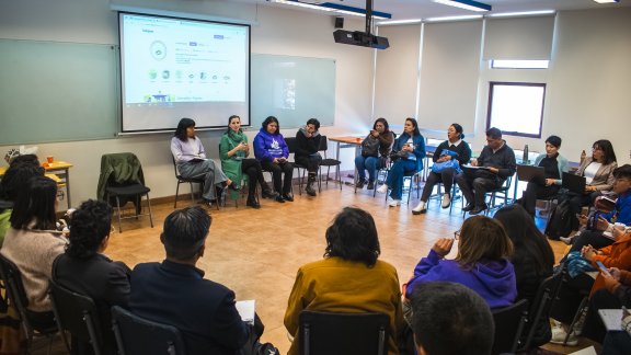An audience listens to a discussion held as part of Abrelatam in Bolivia.