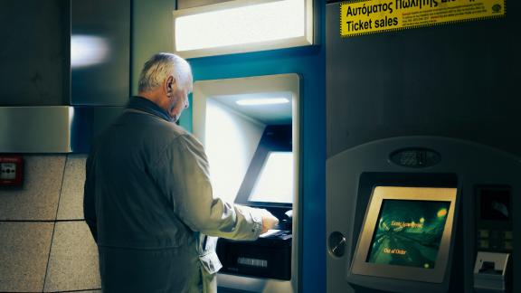 A man using an ATM.