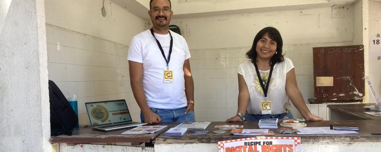 Haythem Ben Zid (Oxfam in Tunisia), Lu An Mendez (Fundación InternetBolivia.org) at ReCIPE's booth at the Global Gathering.
