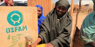 A Woman in Beledweyne fetching water from a tap. 