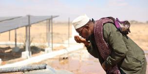 Abdirisaq drinking fresh water