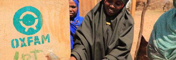A Woman in Beledweyne fetching water from a tap. 