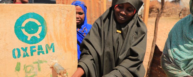 A Woman in Beledweyne fetching water from a tap. 