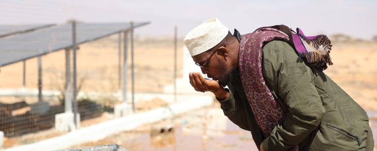 Abdirisaq drinking fresh water