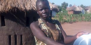 Betty Keji washes her saucepans