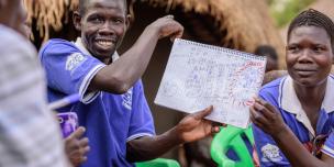 Joseph and Victoria Wadribo show their family vision. With the Oxfam GALS methodology, couples are planning together,developing their visions and in a way becoming accountable to each other. Joseph and Victoria Wadribo show their family vision. Photo credit: Oxfam