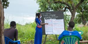 Jennifer Akongo Sunthia, 24, Teacher in Palabek refugee settlement conducting a learning session in one of her students' home
