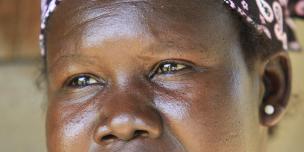 Vita from Arua believes in growing trees besides food crops.She grows mangoes among other fruits and says "I  believe in taking care of the environment because we  live off it and if it’s destroyed, we will not survive." photo by James Akena/Oxfam