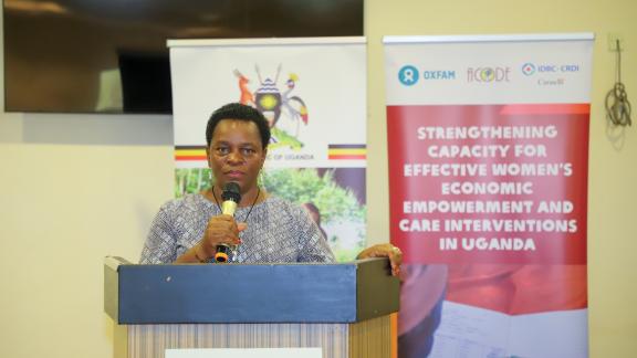 Hon Peace Regis Mutuuzo speaking at the day of Care and Support