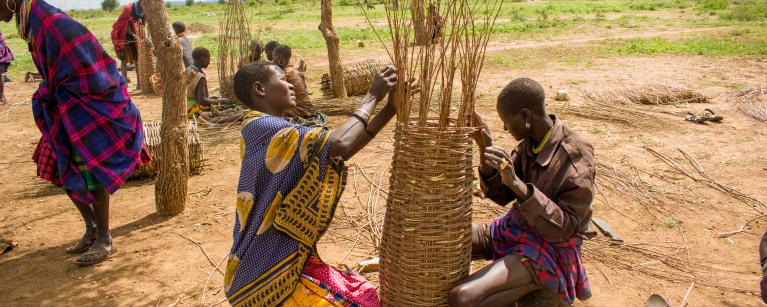 Beekeepers in Moroto, making beehives