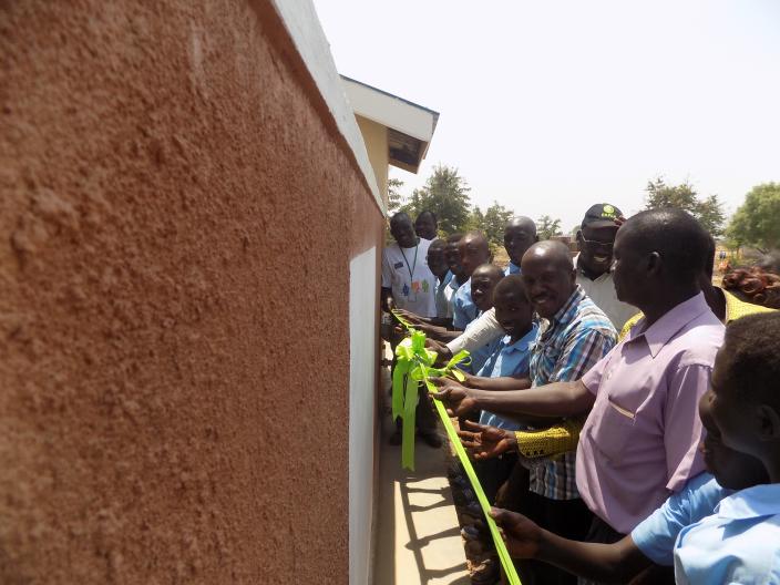 Boys at Eden II Primary school join Baskania Armitege, Rhino Camp Settlement Commandant to officially commission the latrine blocks for use. Photo credit:Oxfam